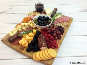 Discover how to make an easy and gorgeous cheese and charcuterie board for your next party! Whether it's girl's night or a holiday celebration, we have ideas for a simple, DIY grazing board appetizer platter that will wow your guests! #cheeseboard #charcuterie #appetizer #partyfood #grazingboard