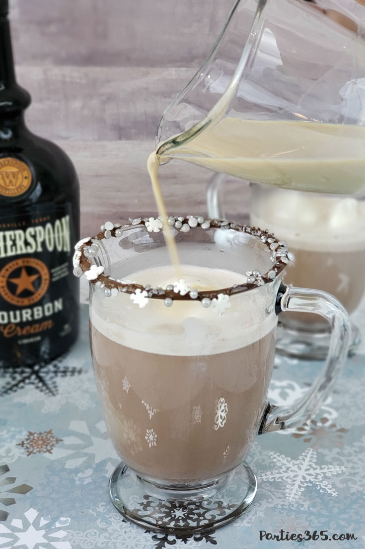 pouring bourbon cream into hot chocolate