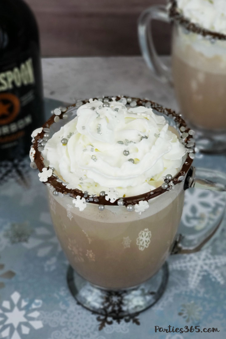 whipped cream on top of boozy bourbon hot chocolate winter cocktail