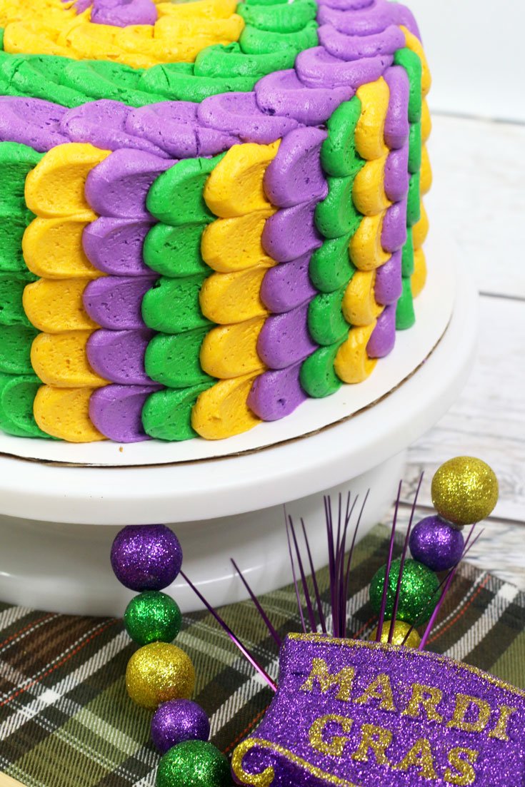 Looking for easy cake design ideas for a festive Mardi Gras cake? We have the perfect simple recipe celebrating the yellow, purple and green decorations of the holiday!