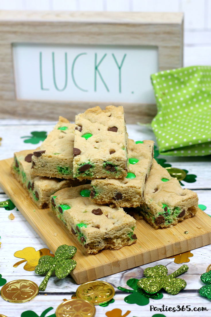 This chewy and delicious St. Patrick's Day Cookie Bar recipe is perfect for a festive dessert! Add chocolate chips and green M&Ms for an easy sheet pan cookie winner!