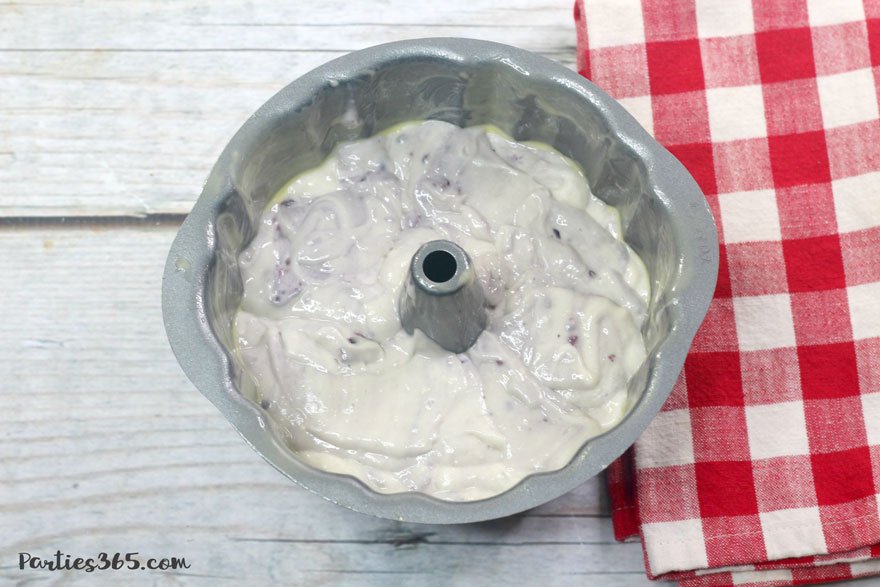 blackberry vanilla cake batter in a bundt pan