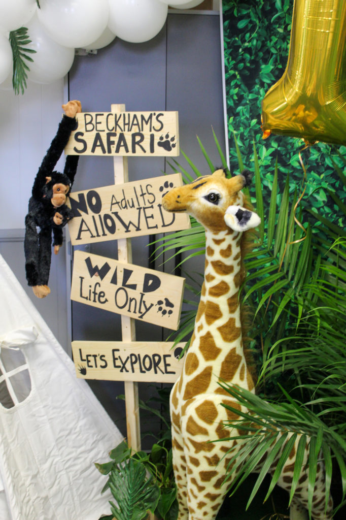 safari party decor sign with giraffe and monkey