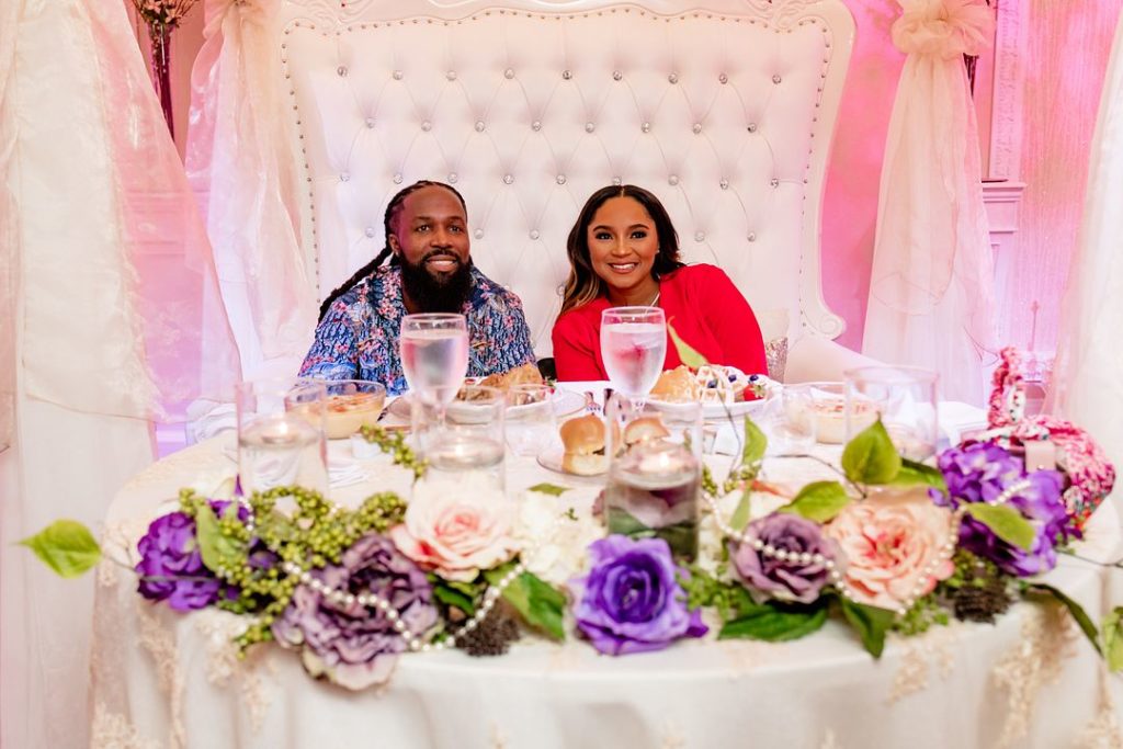 couple at baby shower head table