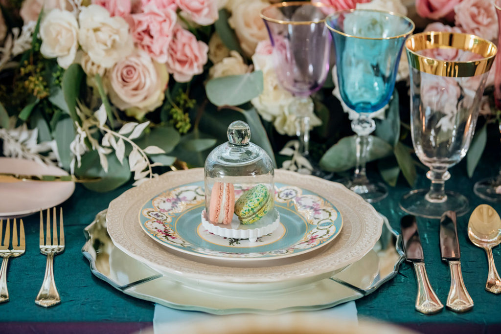 mini cloche with macarons on Easter place setting