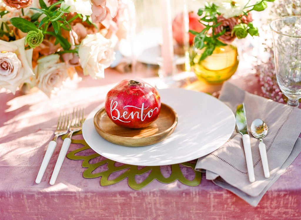 pomegranate name card at place setting