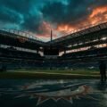Hard Rock Stadium at dusk, home of the Miami Dolphins, under a dramatic stormy sky