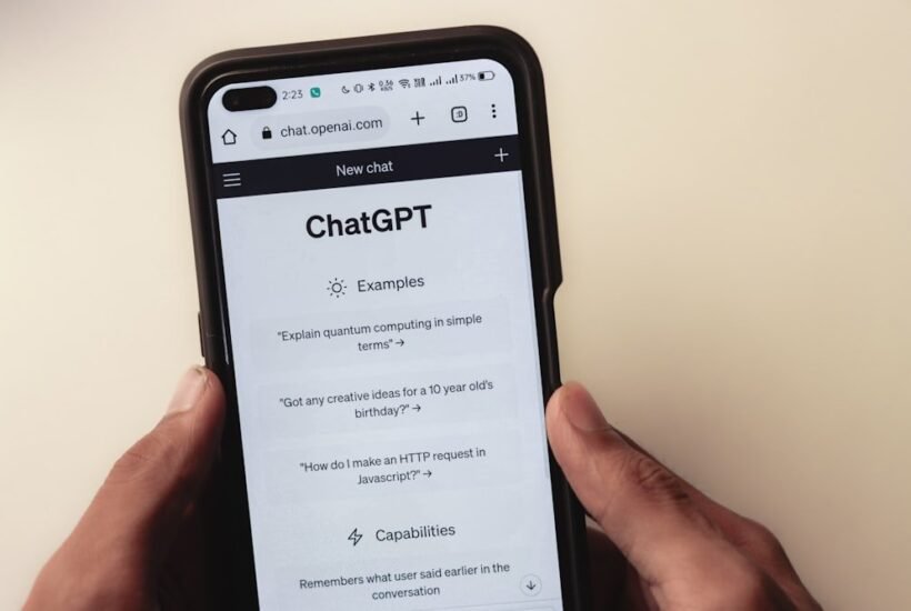 Hands holding a phone with a ChatGPT conversation open, the starting point for finding apps similar to ChatGPT for free