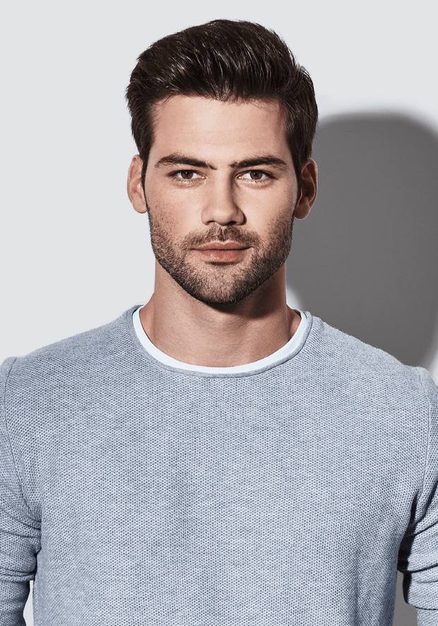 Man with short dark hair and a beard in a grey jumper, a Rush Hair & Beauty photo for blend-away greys