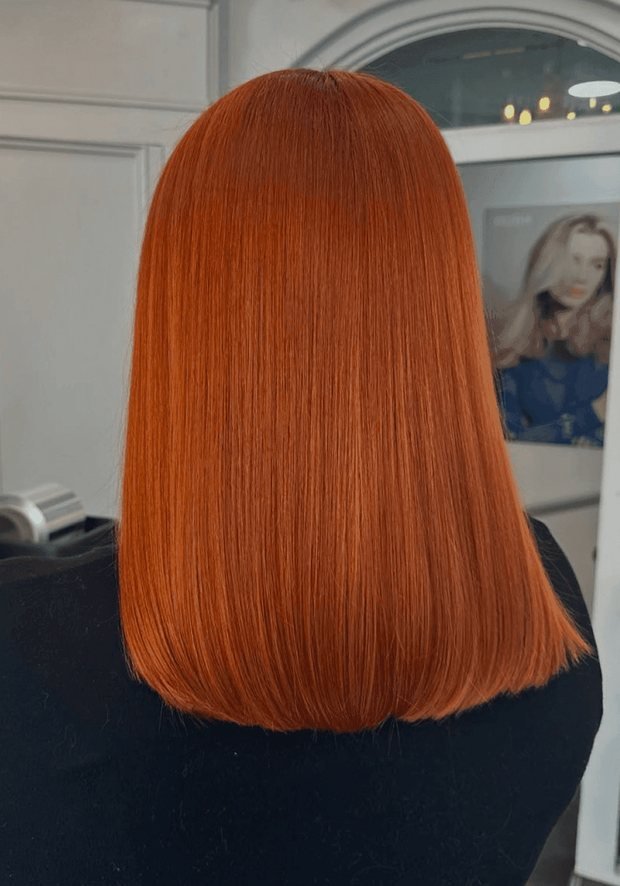 Copper-orange blunt bob from behind after a full head permanent colour, a Rush Hair & Beauty photo